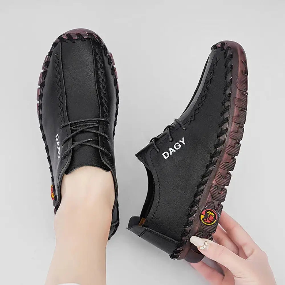 Black leather women’s soft lace-up loafers with braided detailing rubber soles and dagy brand logo on the side