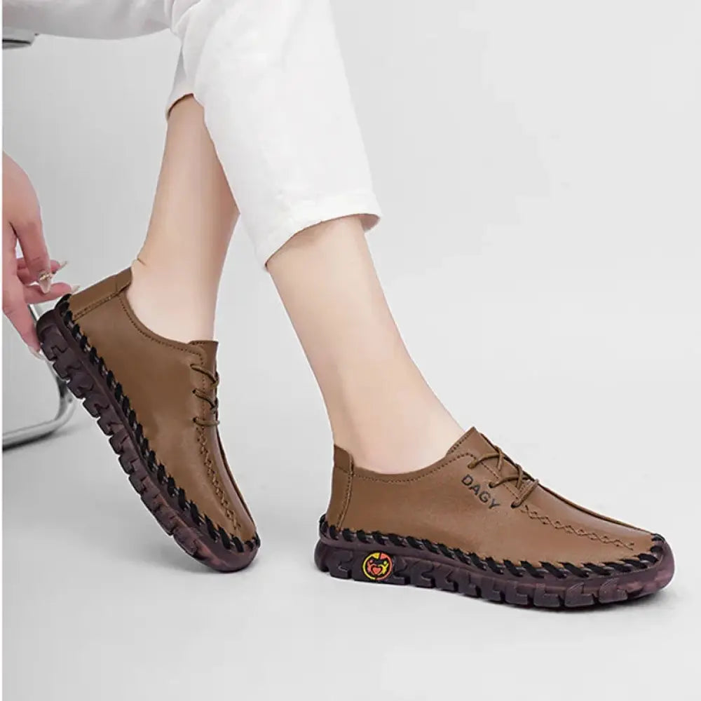 Brown leather women’s soft lace-up loafers with braided sole and dark brown rubber outsole by dagy
