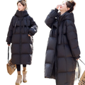 Black women long hooded puffer coat with quilted panels, front zipper, and side pockets for cold weather