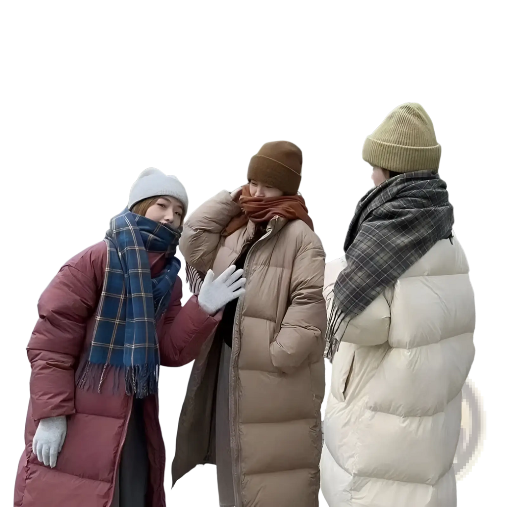 Three women wearing women long quilted puffer coats in maroon beige and cream with matching scarves and beanies