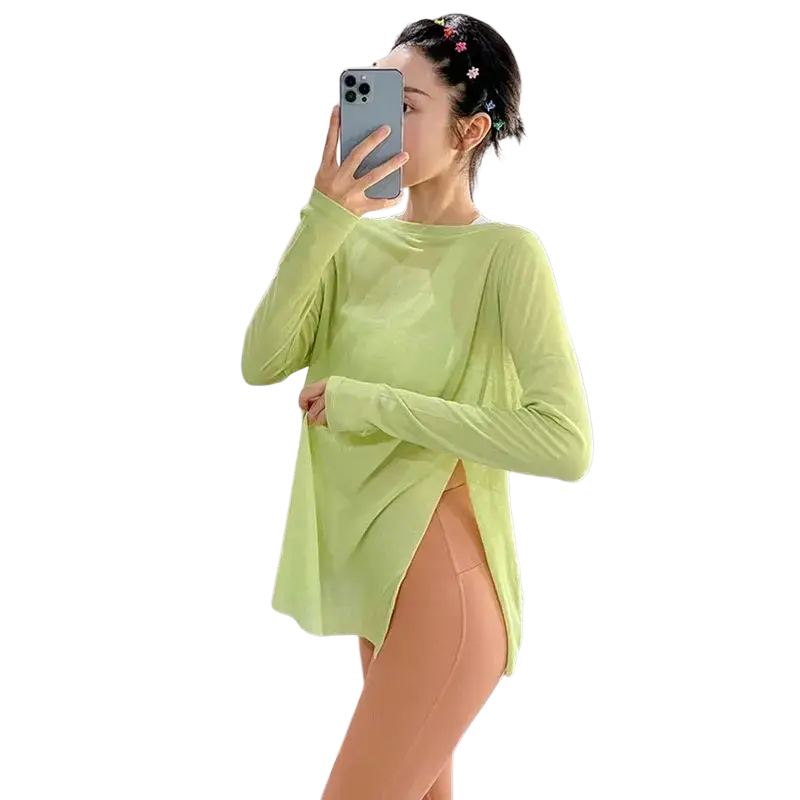 A light green women long sleeve athletic top with side slit and loose fit designed for active wear