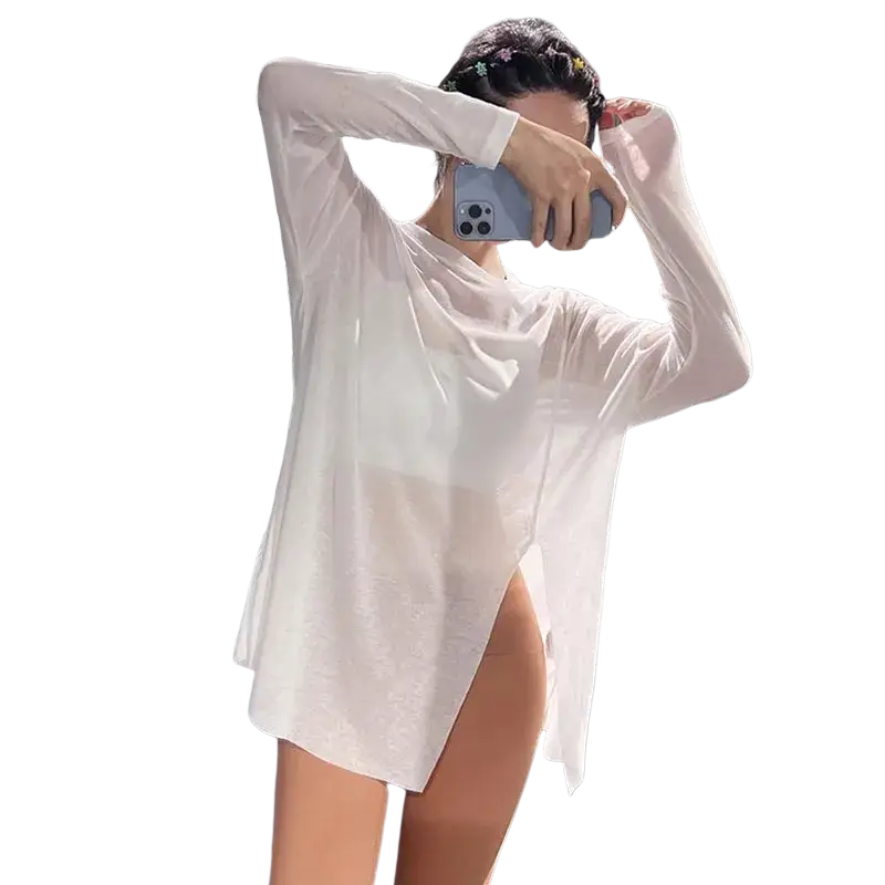 White long-sleeved sheer tunic top with side slit designed for women in athletic wear