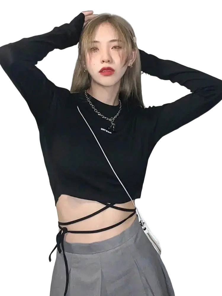 Black long sleeve crisscross crop top with tie details at the waist for women in a lightweight fabric
