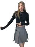Black long sleeve crisscross crop top with tied side details made of soft fabric for women