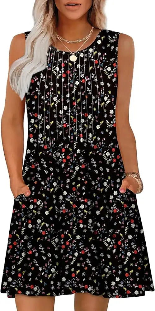 Women’s loose black sleeveless summer beach dress with red white and green floral pattern and vertical beaded front detailing