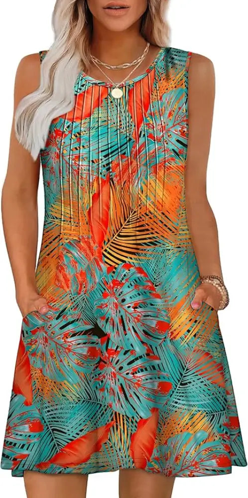 Women’s loose tropical print sleeveless summer beach dress in teal orange and yellow with pleated front detail
