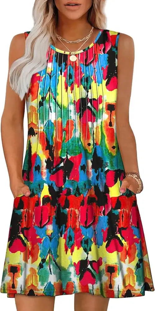 Women’s loose sleeveless summer beach dress with vibrant red yellow blue and black abstract floral pattern