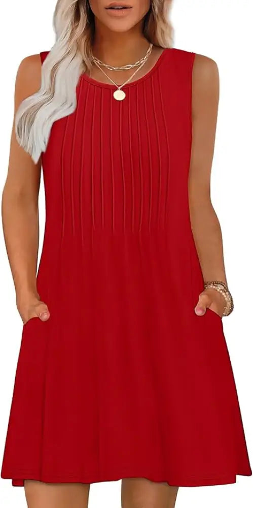 Red sleeveless women’s loose summer beach dress with vertical pleats and side pockets featuring geometric and tropical design