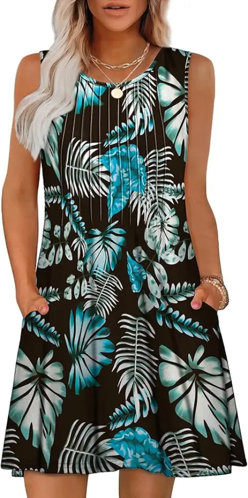 Women’s loose black sleeveless summer beach dress with vibrant teal tropical leaf pattern and geometric design