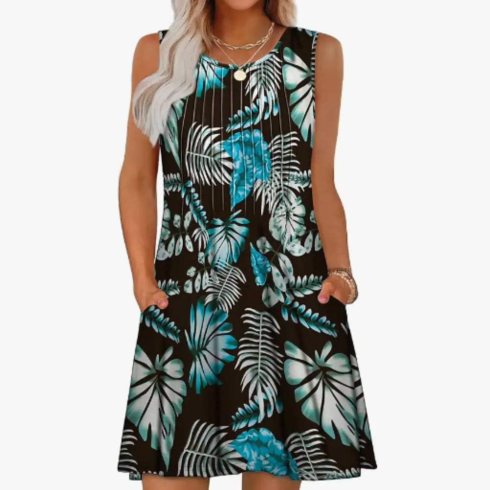 Women’s loose sleeveless black dress with vibrant teal and white tropical leaf pattern for summer beachwear