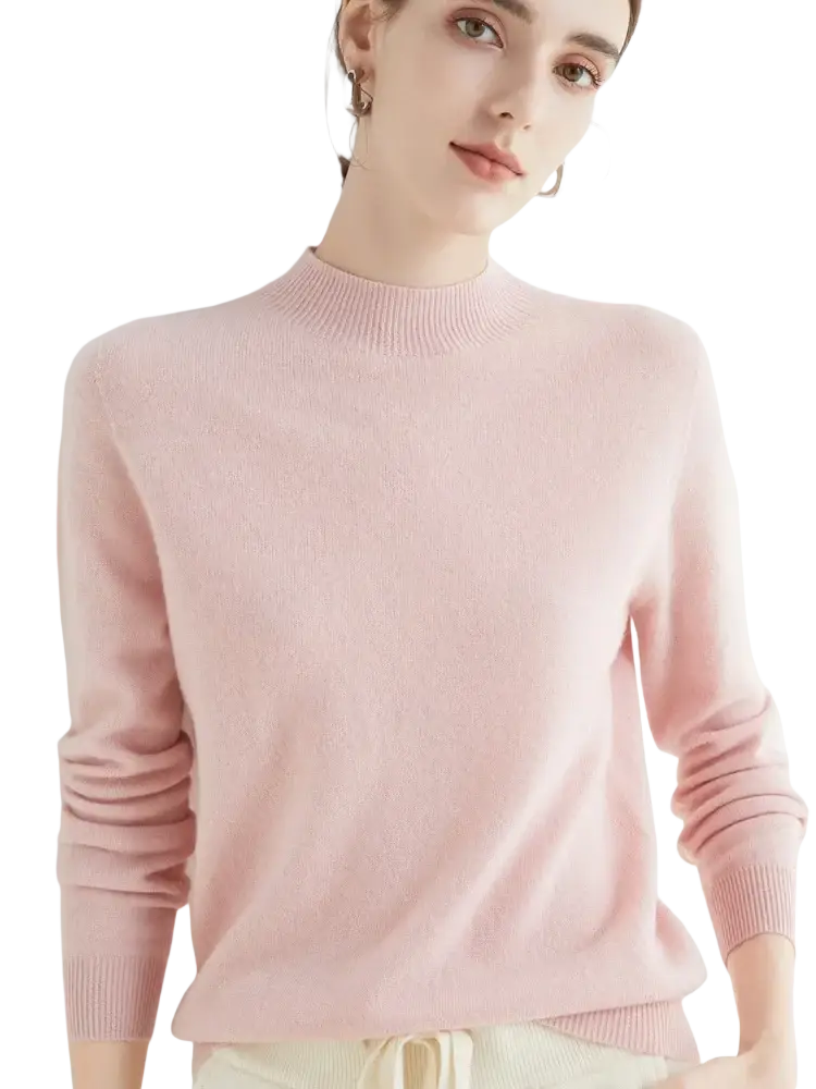 A soft pink women merino wool half high collar sweater with long sleeves and ribbed crew neckline and cuffs