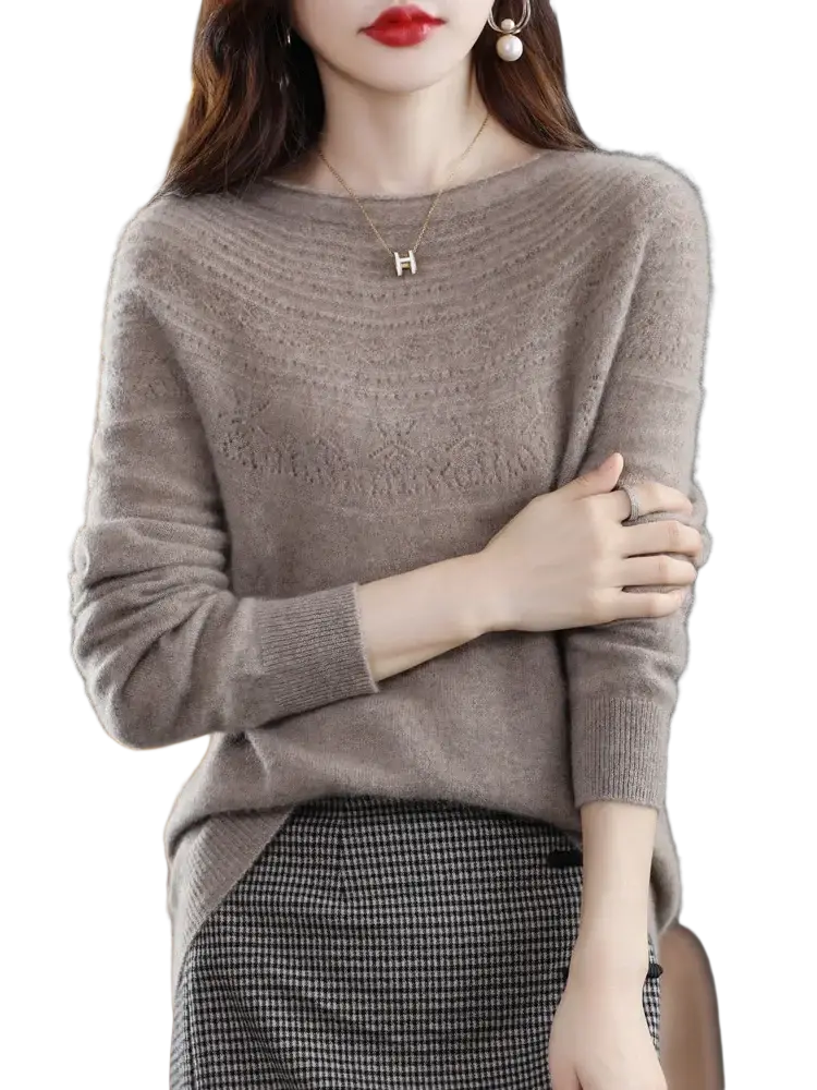 A soft beige merino wool o-neck sweater with textured pattern and ribbed cuffs for women