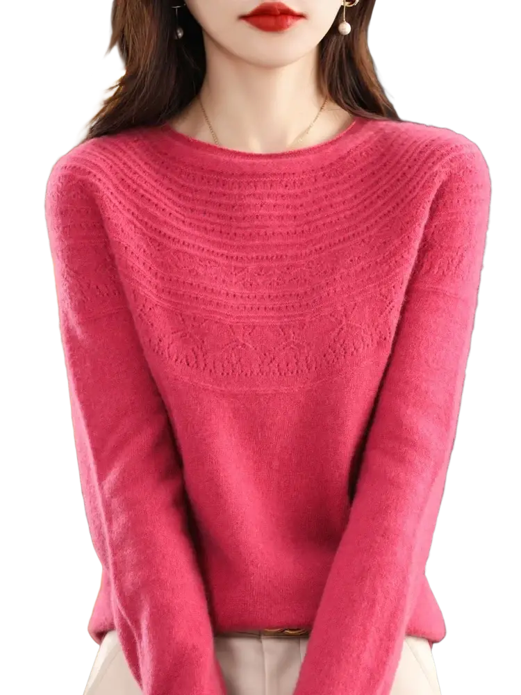 A soft vibrant pink women merino wool o-neck sweater with a textured pattern across the chest and shoulders