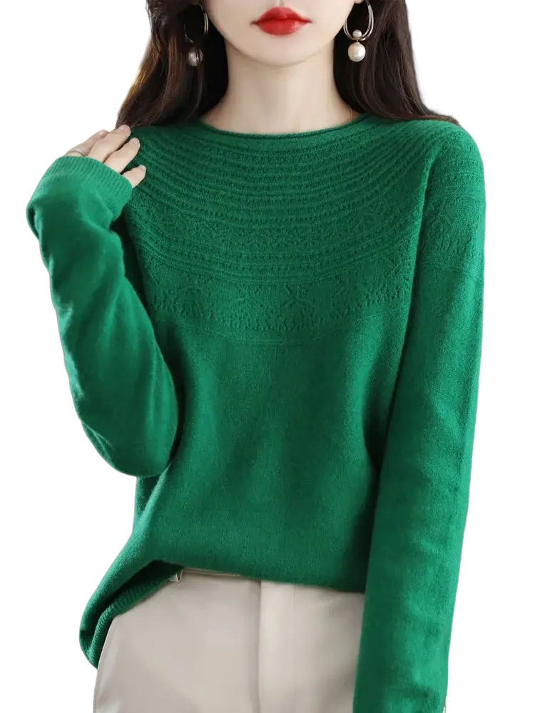 A vibrant emerald green women merino wool o-neck sweater with a textured patterned yoke and ribbed cuffs