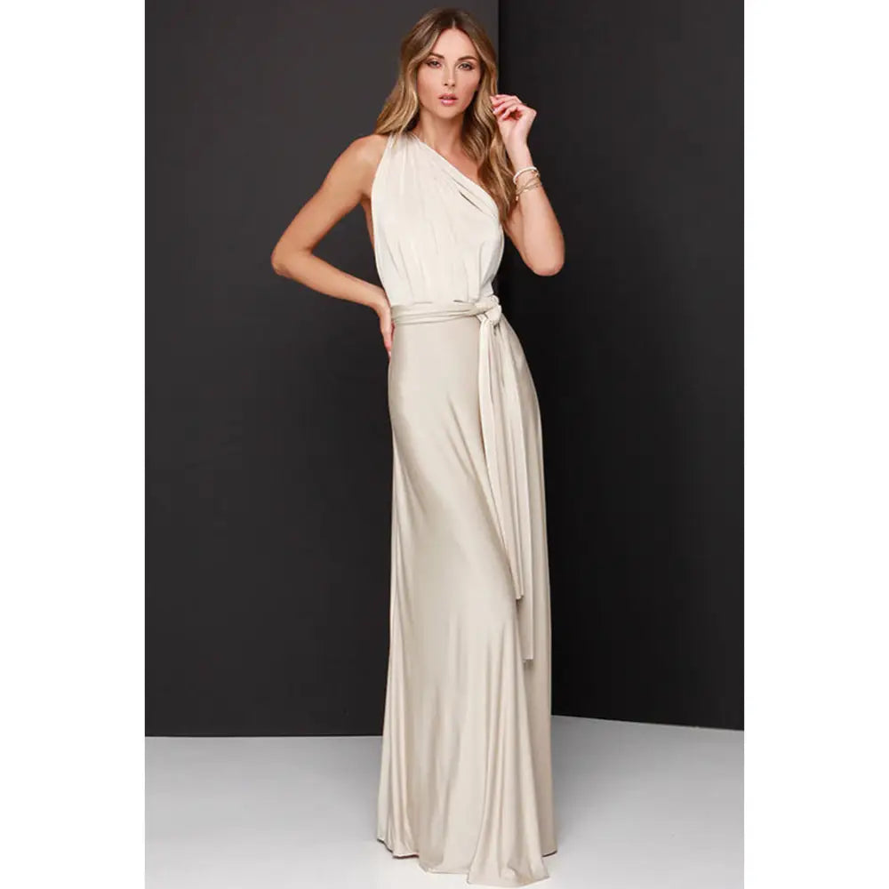 A flowing off-white satin maxi dress with draped one-shoulder neckline and matching self-tie belt for parties