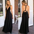 Black satin multiway halter neck maxi party dress with deep v front and back tie details shown from the back side