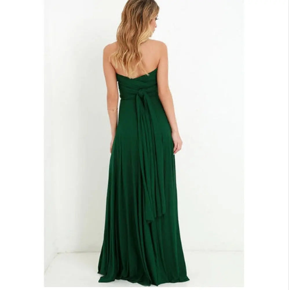 A flowing emerald green satin strapless maxi dress with a draped waistband for party occasions