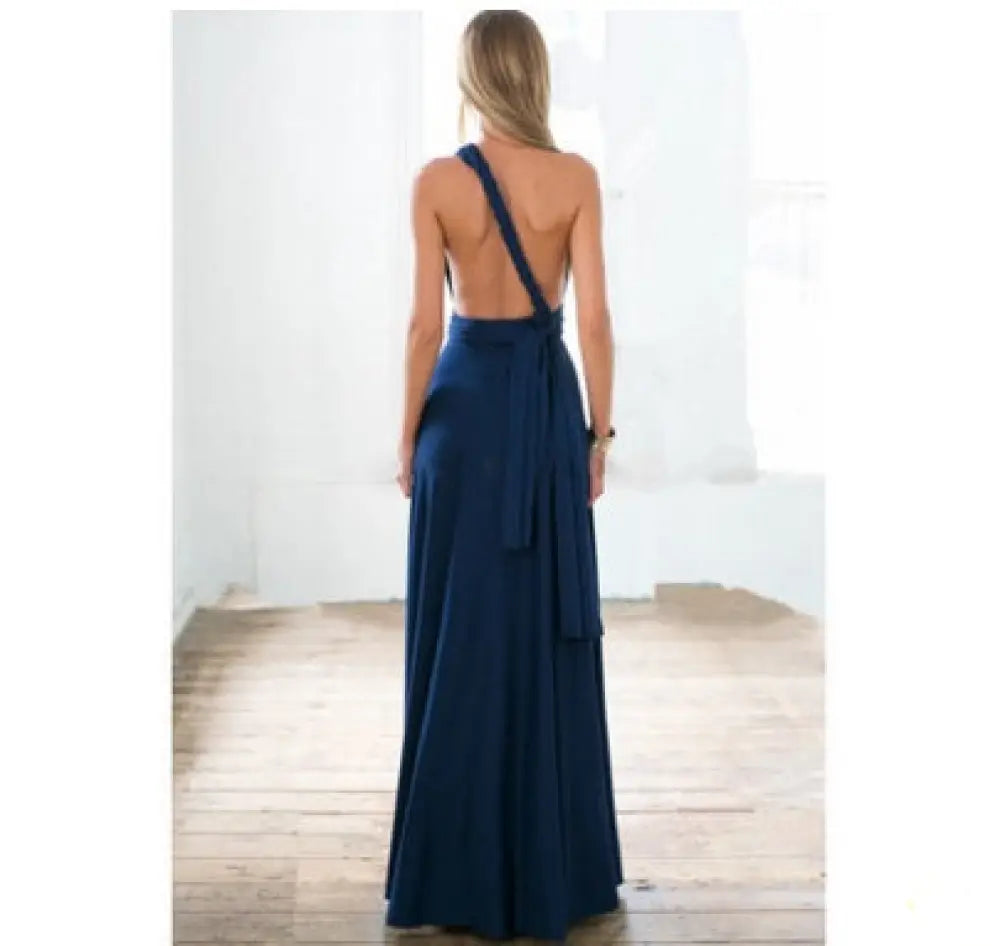 Navy blue satin multiway halter neck maxi party dress with single shoulder strap open back tied at waist viewed from back