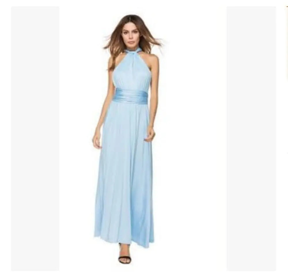 A flowing light blue multiway satin halter neck maxi party dress with a satin belt at the waist