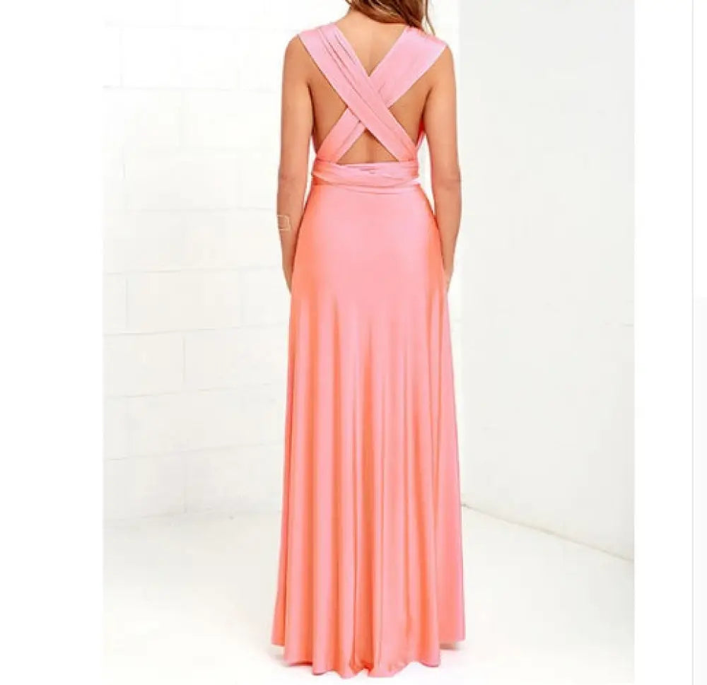 Coral-pink satin multiway halter neck maxi party dress with fitted waistband and back cross-cut design shown from back