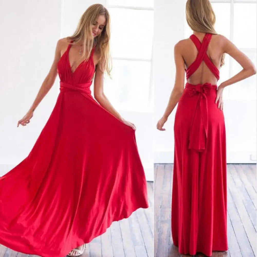 A flowing red satin multiway halter neck maxi party dress with deep v-neckline and crisscross back straps shown from back