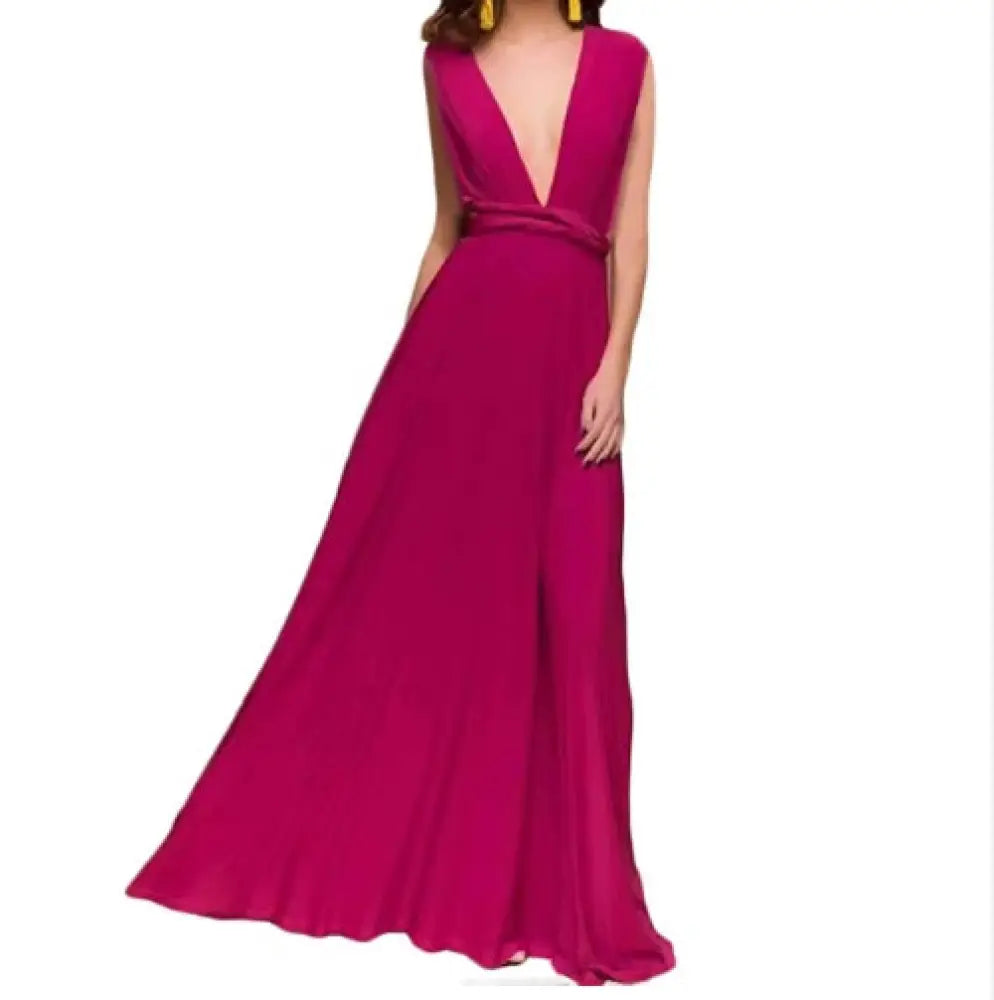 A flowing fuchsia satin multiway halter neck maxi party dress with deep v-neckline and cinched waistband