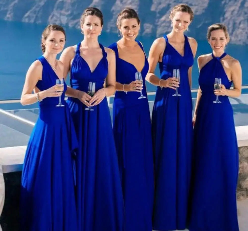 Five women wearing royal blue satin multiway halter neck maxi party dresses with varying plunging v-necks