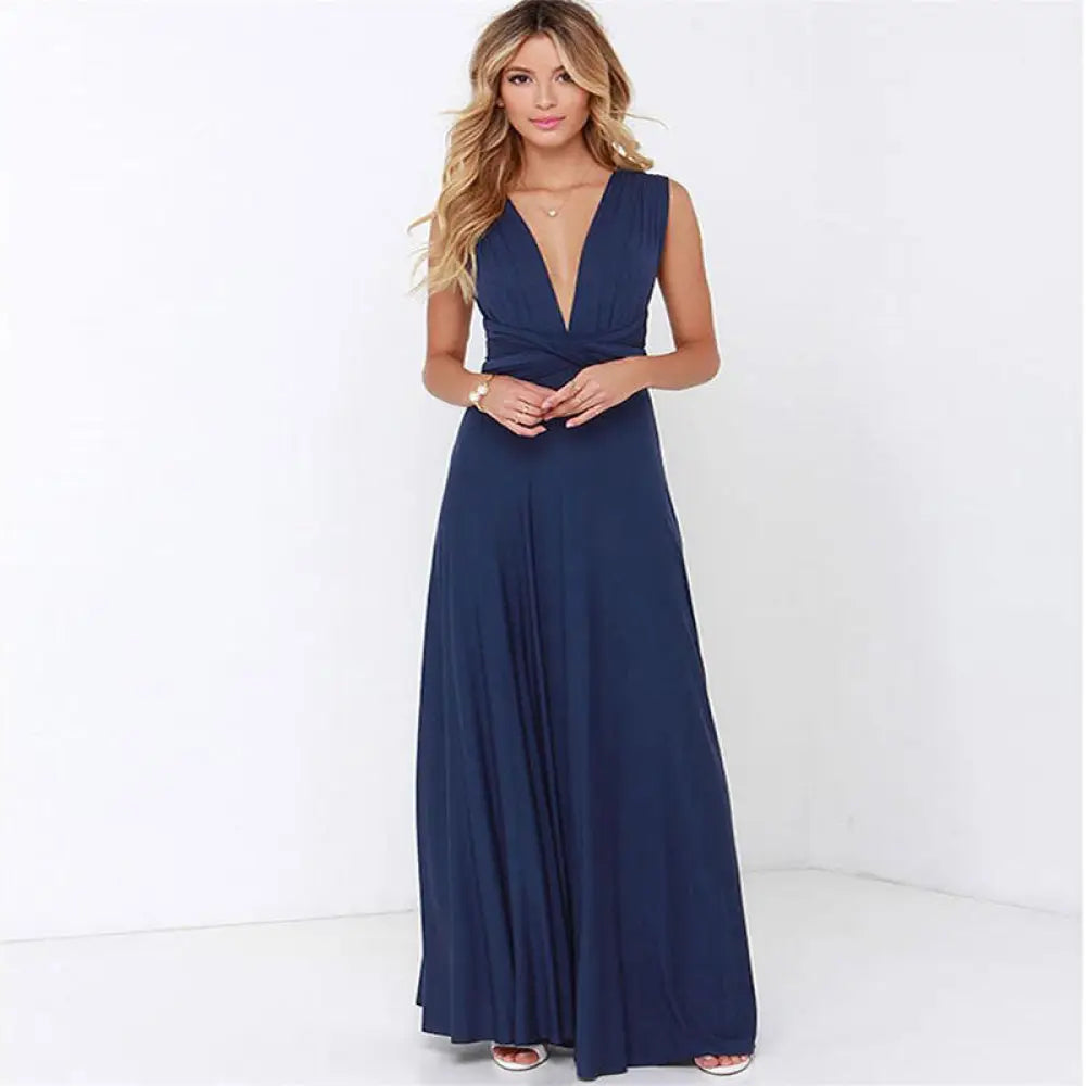A navy blue satin multiway halter neck sleeveless maxi party dress with a deep v-neckline and flowing fabric