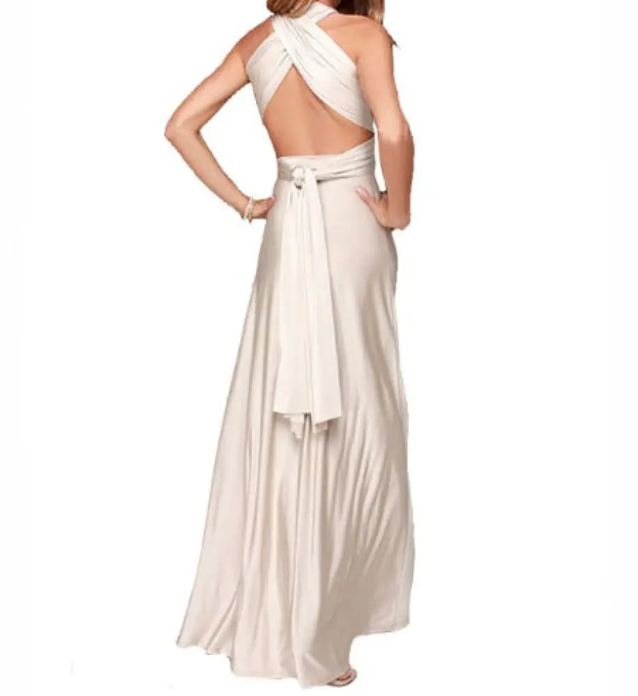 Off-white satin multiway halter neck maxi party dress with flowing fabric and back tie detail shown from the back