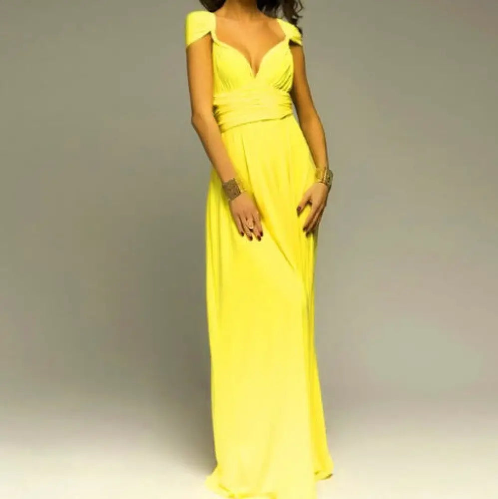 A vibrant yellow satin multiway halter neck maxi party dress with off-the-shoulder deep v-neckline and fitted waist