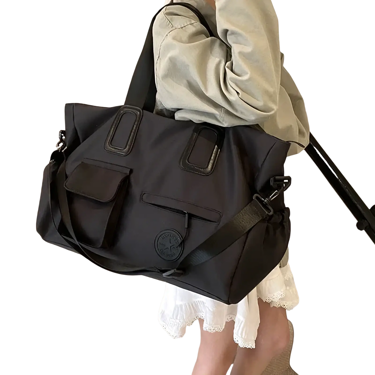 Black nylon women travel duffel bag with reinforced leather-like handles and circular logo patch for gym and multi pocket use