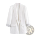 White blazer with olive green striped cuffs and front pockets made of tailored fabric for women