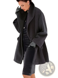 A dark charcoal oversized woolen overcoat with a wide collar and matching gloves for women