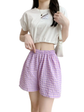 Purple and white gingham plaid loungewear shorts with elastic waistband made of cotton blend for women