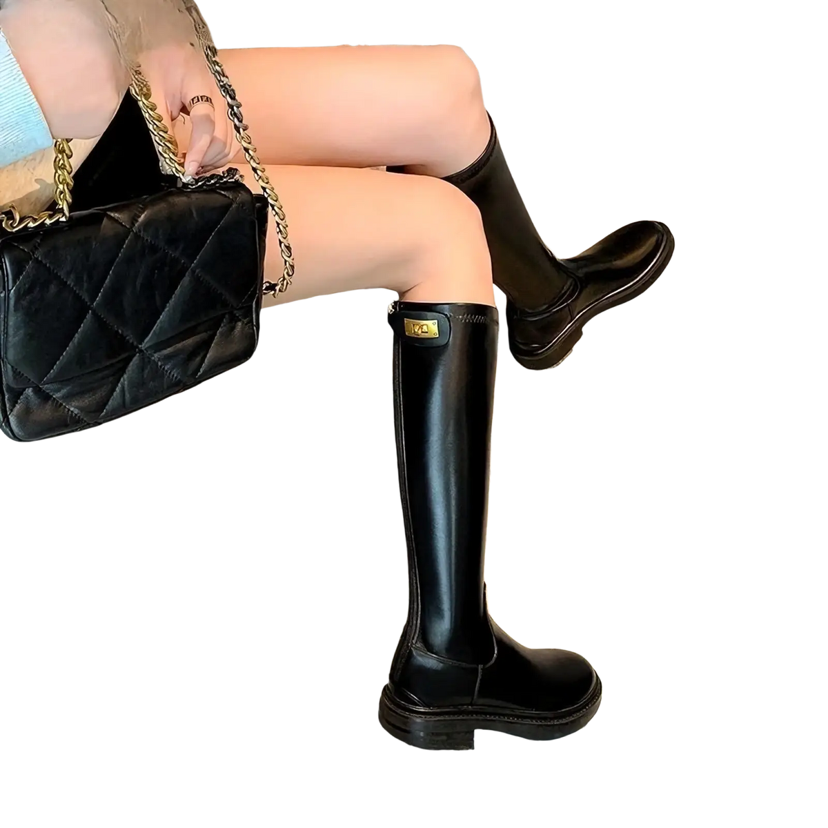 Black knee high boots with glossy finish and gold tone branding on the side in brown leather platform design