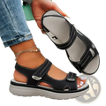 Women platform sandals in black leather look with silver buckle accents and thick cushioned sole for casual beach wear