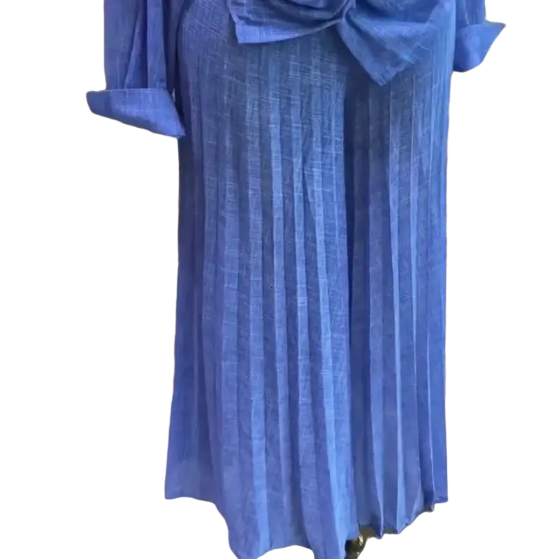 A flowing blue pleated maxi skirt with matching top in textured fabric and an elegant draped bow at the waist