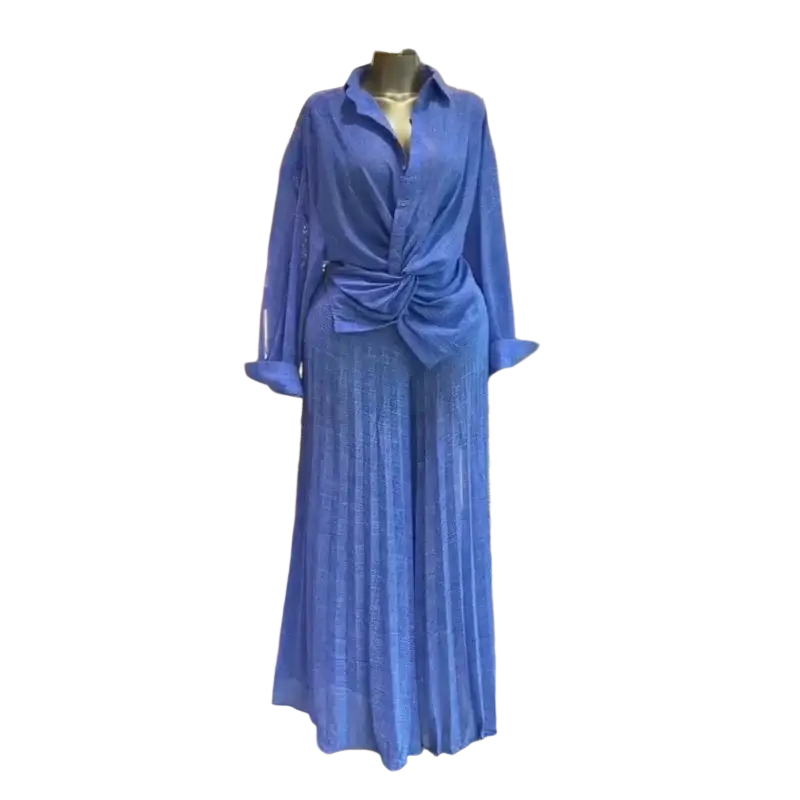 A stylish women pleated wide leg pant set in soft blue featuring a long sleeve button-up shirt tied at the waist