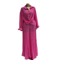 A vibrant fuchsia women pleated wide leg pant set with a long sleeve knotted button-up shirt on a golden mannequin