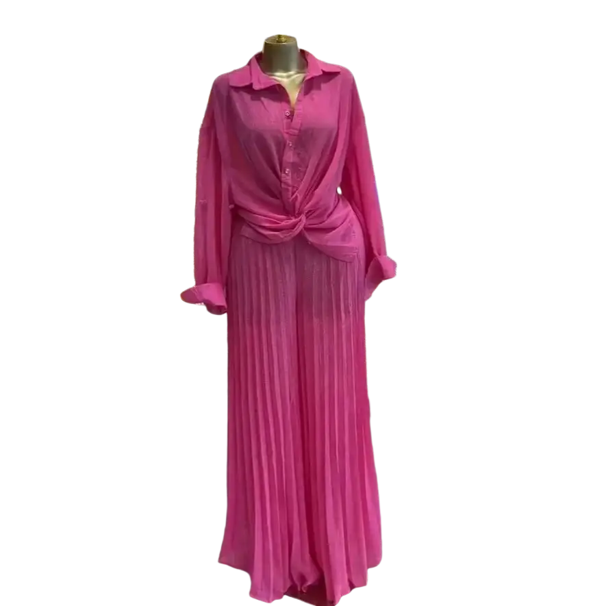 A vibrant fuchsia women pleated wide leg pant set with a long sleeve knotted button-up shirt on a golden mannequin