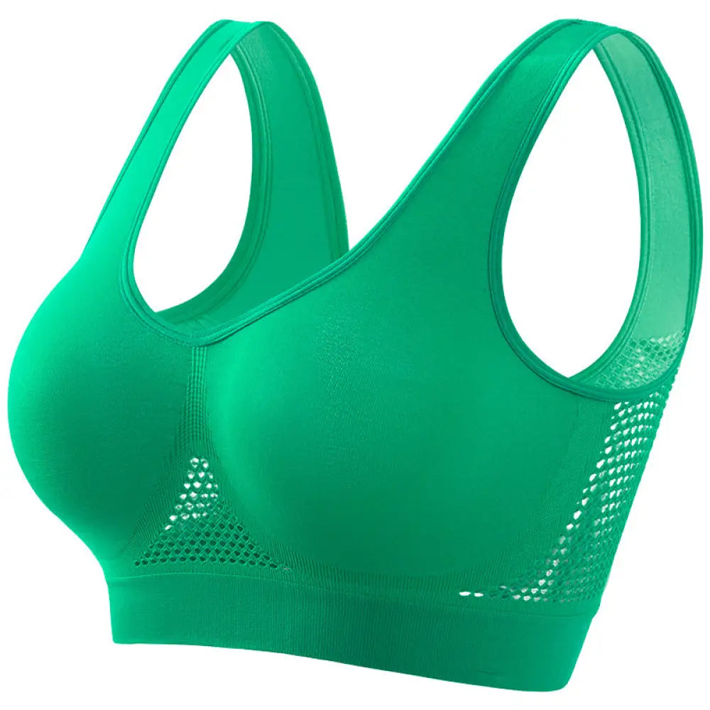 Vibrant green seamless plus size sports bra with mesh panels and wide supportive straps for moisture wicking