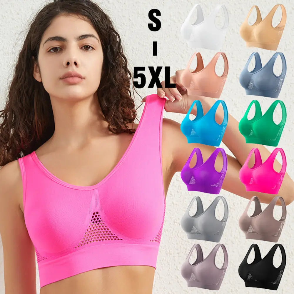 Bright pink seamless plus size sports bra with moisture wicking mesh paneling for enhanced support and comfort