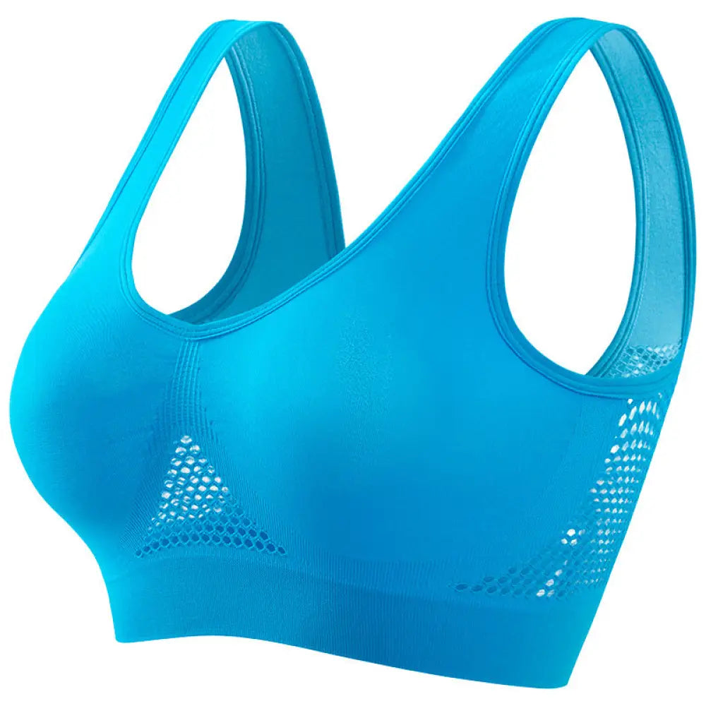 Bright blue seamless plus size moisture wicking sports bra with mesh panel detailing on the sides