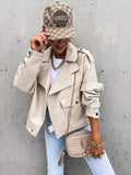 Beige quilted ysl crossbody bag with gold chain strap and tassel paired with women’s relaxed beige faux leather jacket with pockets