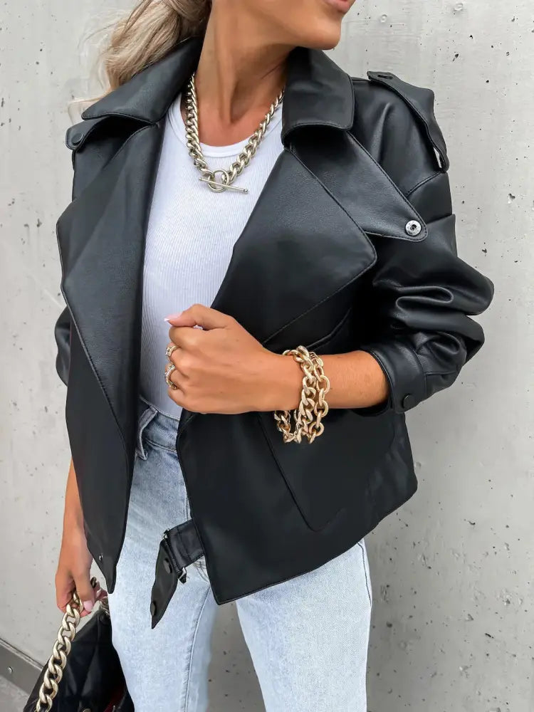 Women’s relaxed beige faux leather jacket with pockets and a black faux leather moto jacket with structured shoulders and silver buttons