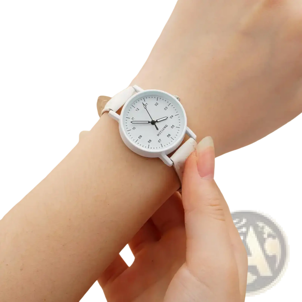White minimalist women quartz watch with pu leather strap and waterproof feature worn on wrist with clean dial
