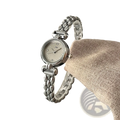 Silver-toned women quartz watch with delicate beaded metal bracelet and round face with diamond-like accents