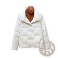 Women quilted lightweight white down puffer jacket with high collar and button closure worn over orange turtleneck