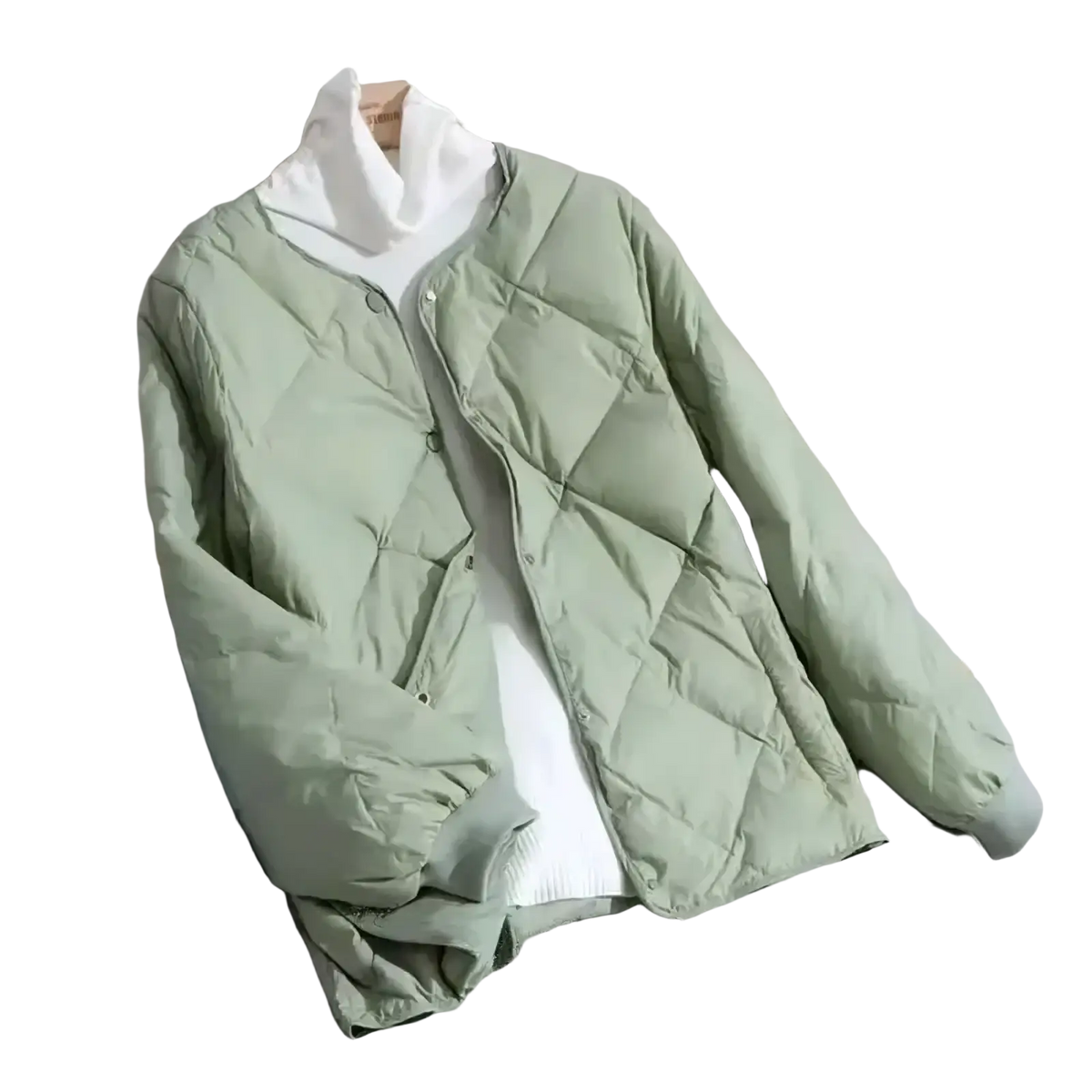 Woman quilted puffer jacket in soft mint green with lightweight insulation button-front and ribbed cuffs for winter wear