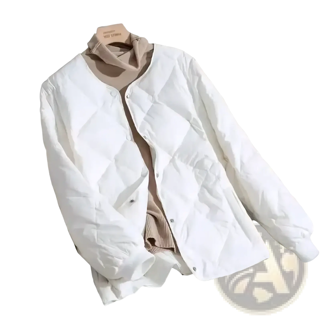 White quilted puffer jacket with soft padded texture and button closure for lightweight winter wear for women